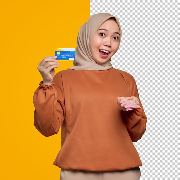 오렌지색 셔츠를 입은 젊은 아시아 여성이 지폐를 들고 신용카드를 보여주고 있다