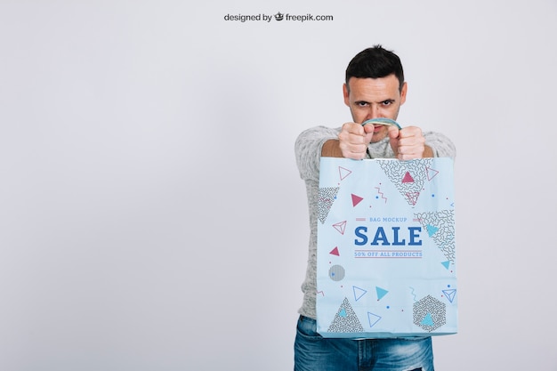 Shopping bag mockup with man and space on left