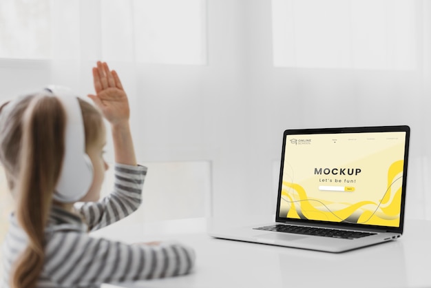 side view girl with headphones and laptop