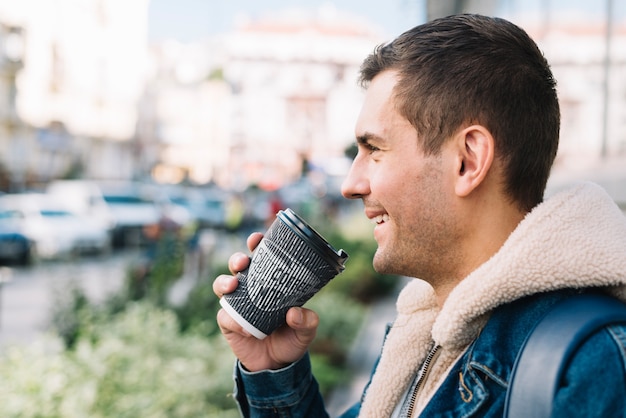 PSD side view of man with coffee cup mockup