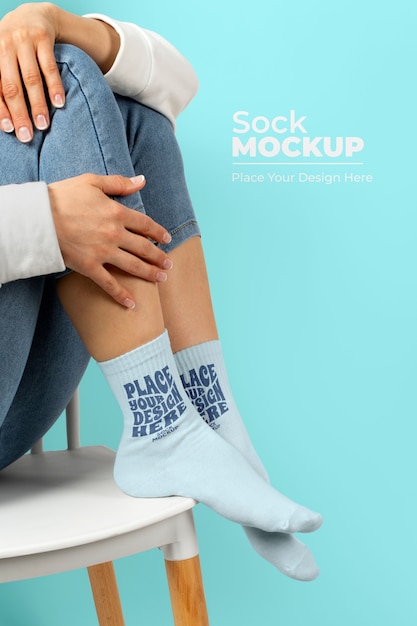 Side view model posing with socks mockup