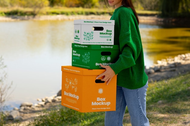 PSD side view woman carrying boxes