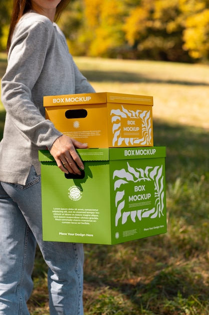 PSD side view woman carrying boxes