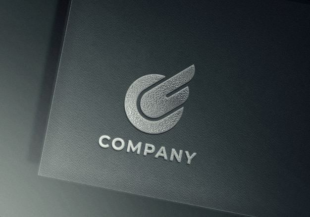 Silver embossed logo mockup on gray textured paper