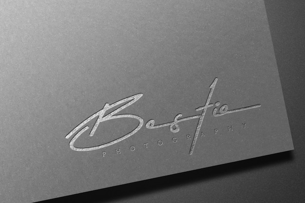 PSD silver logo mockup on dark paper