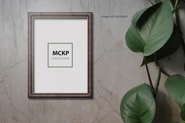 Mockup di cornice semplice sul muro con pianta