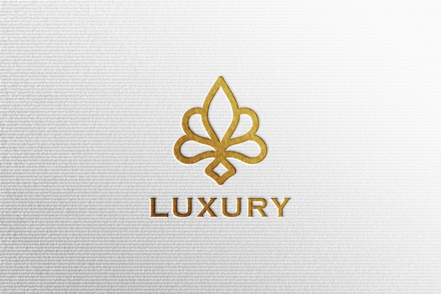 PSD simple luxury debossed gold foil logo mockup on white pressed paper