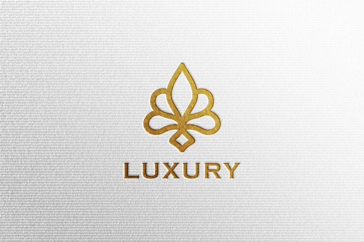 白のプレス紙にシンプルな高級デボス加工の金箔ロゴモックアップ