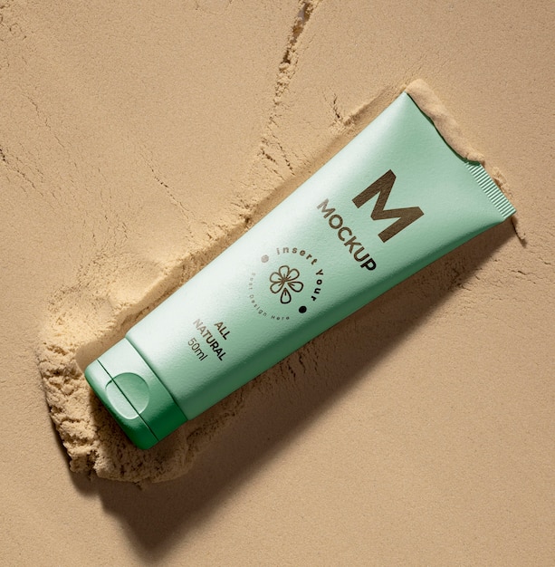 PSD skincare products printed in sand mockup