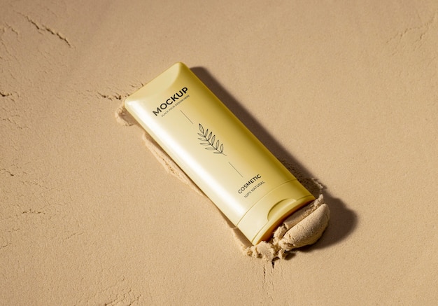 PSD skincare products printed in sand mockup