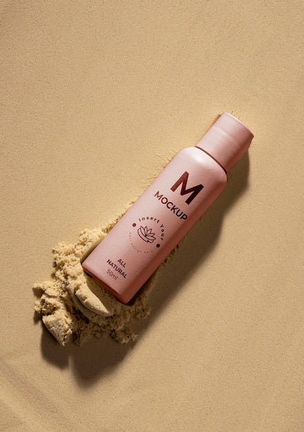 PSD skincare products printed in sand mockup
