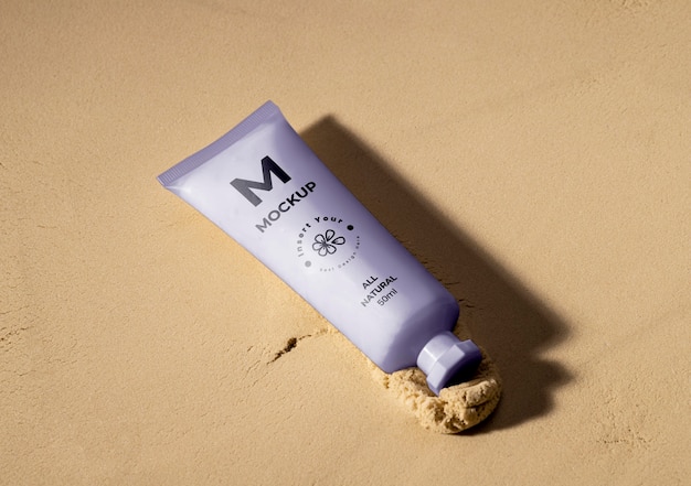 PSD skincare products printed in sand mockup