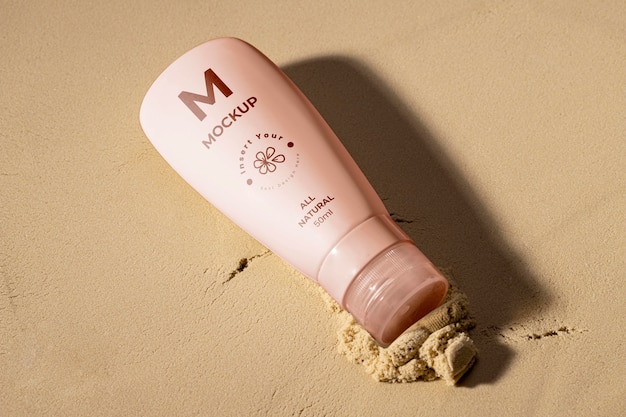 PSD skincare products printed in sand mockup