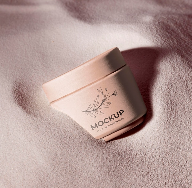 Skincare products printed in sand mockup