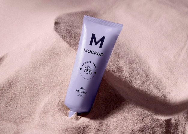 Skincare products printed in sand mockup