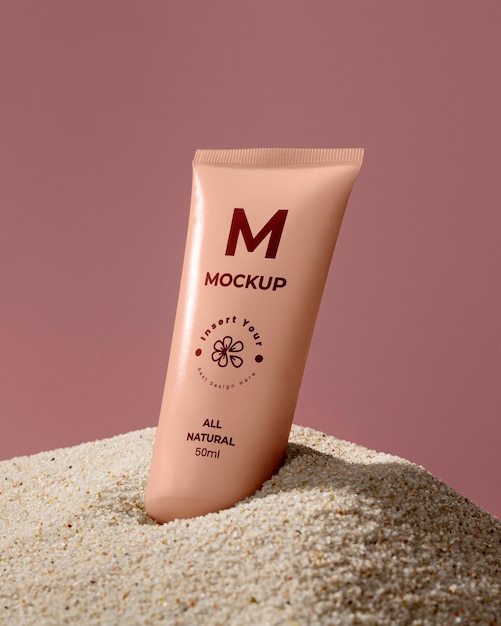 PSD skincare products printed in sand mockup