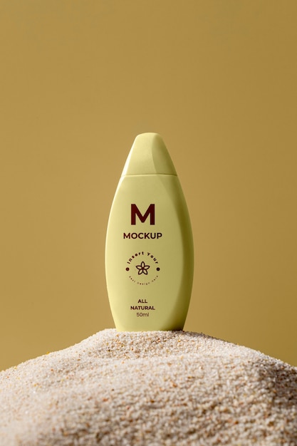 PSD skincare products printed in sand mockup