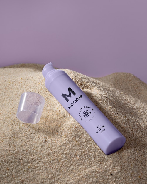 PSD skincare products printed in sand mockup