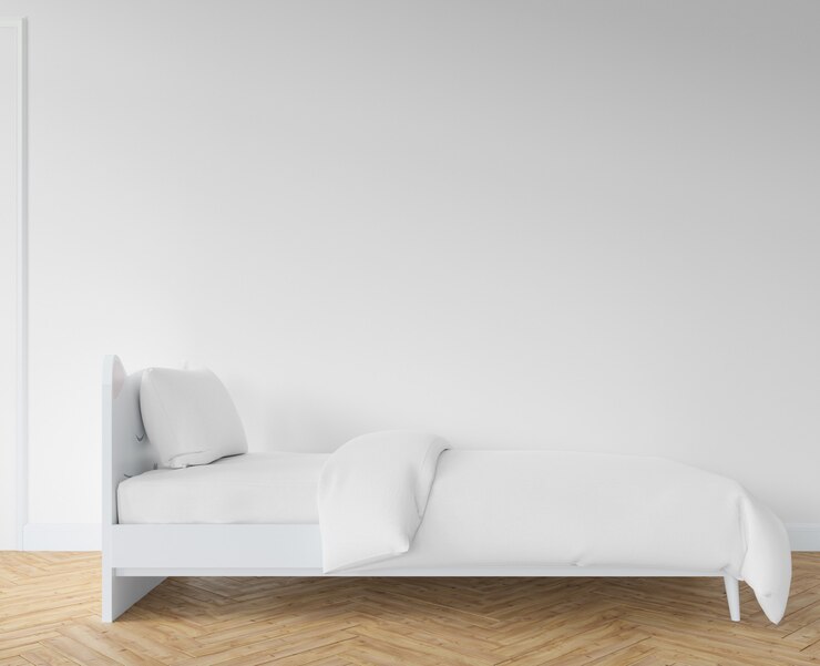 Slaapkamer met witte lakens