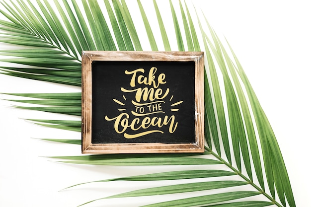 Slate mockup with palm tree leaf