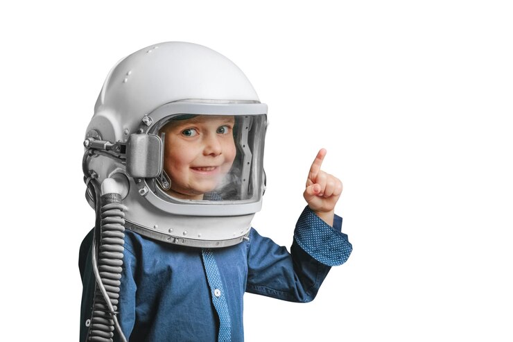 PSD a small child imagines himself to be an astronaut in an astronauts helmet