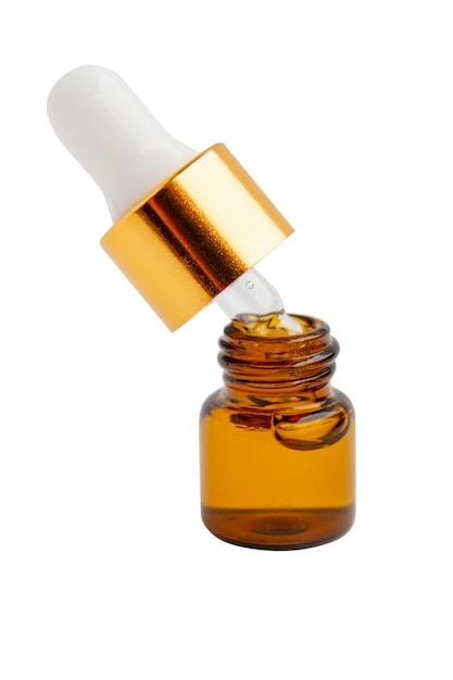 small cosmetic jar with glass pipette serum skin care or medicine on empty background