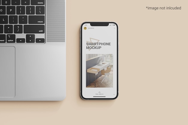 Smart phone screen mockup beside a laptop