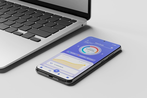 PSD smartphone app mockup with laptop on the side