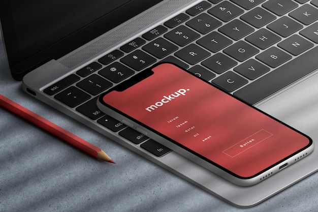 PSD smartphone app screen device mockup presentation on laptop keyboard business office concept isolated