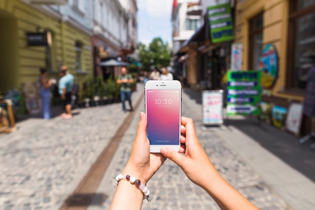 Smartphone mockup in busy street