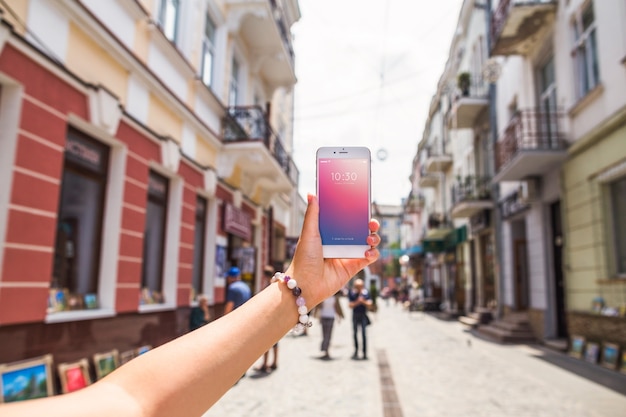 Smartphone mockup in busy street