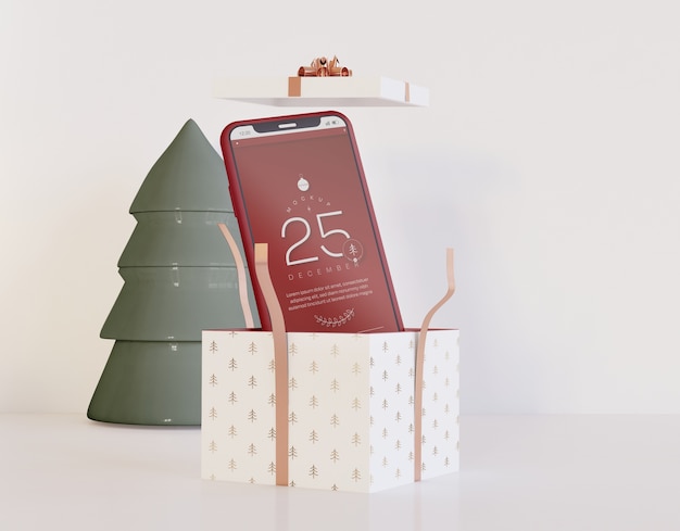 Smartphone mockup all'interno del regalo di natale