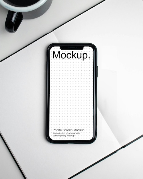 Smartphone mockup op het open boek