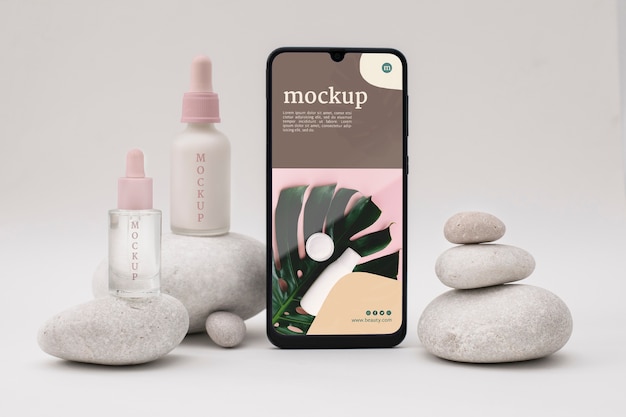 PSD smartphone mockup with cosmetic products