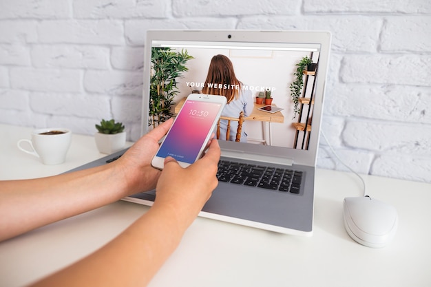 PSD smartphone mockup with laptop