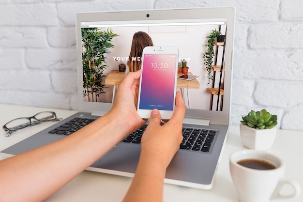 PSD smartphone mockup with laptop