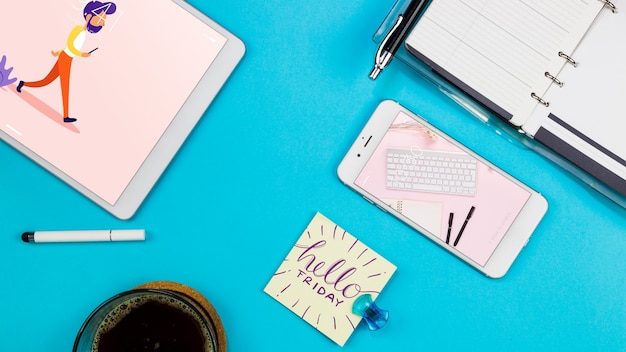 PSD smartphone mockup with office materials on table