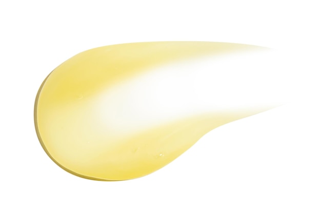 Мазок желтого кремового бальзама-кондиционера с банановым яйцом или ромашкой на пустом фоне Изолированный