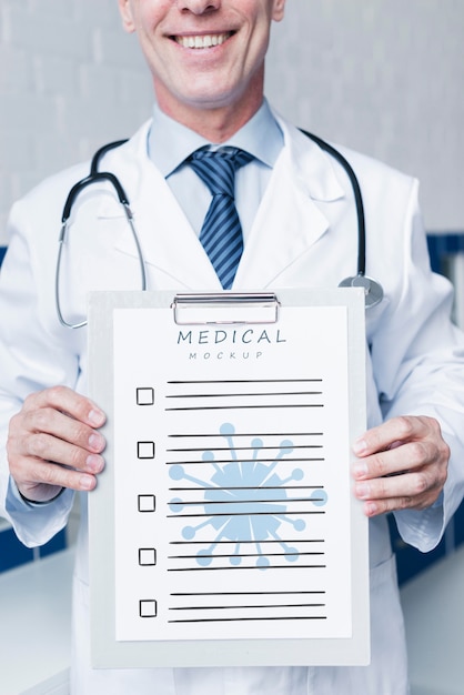 Smiley doctor holding a medical paper mock-up