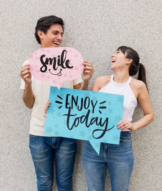 Smiley man and woman posing