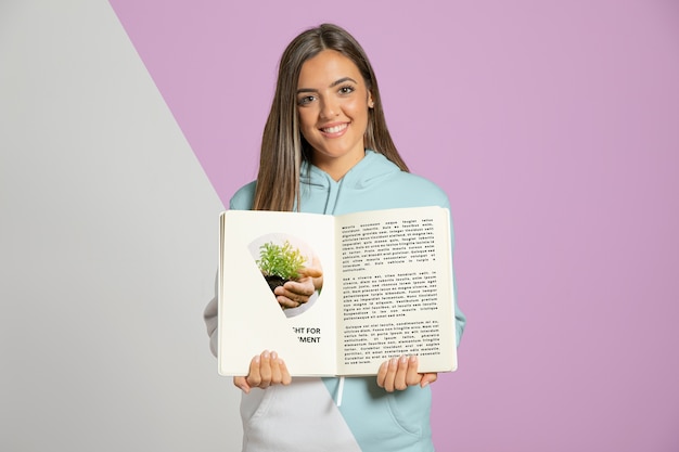 PSD smiley woman holding book