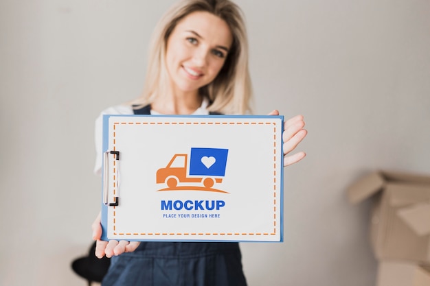 Smiley woman holding clipboard mockup