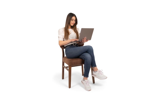 PSD smiling young caucasian full body length shot woman working online sitting in chair