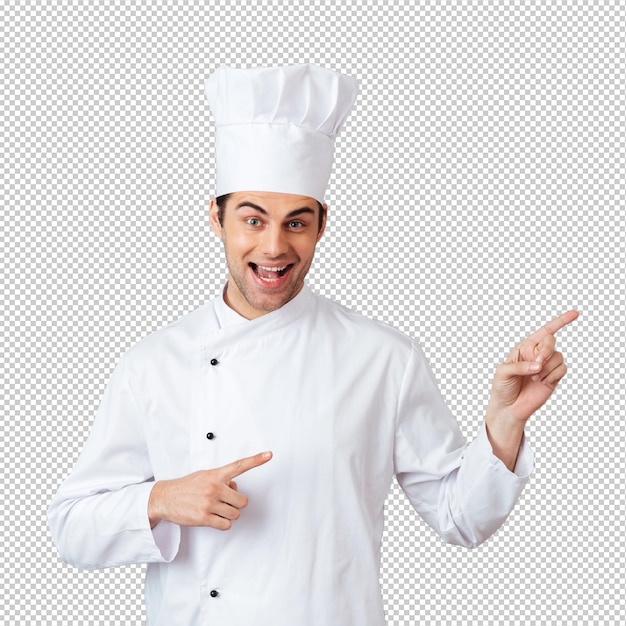 Smiling young cook in uniform pointing