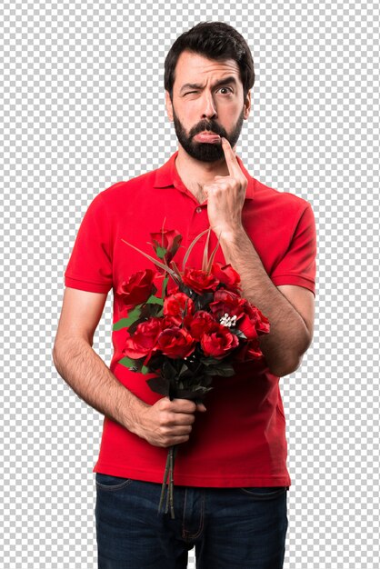 PSD smutni przystojni mężczyzna mienia kwiaty