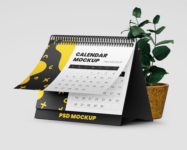 PSD spiral desk calendar mockup with plant