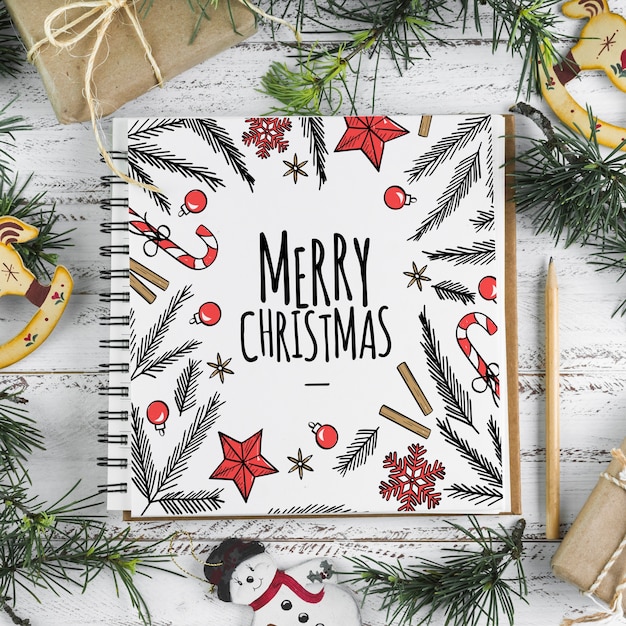 Spiral notebook mockup with christmas concept