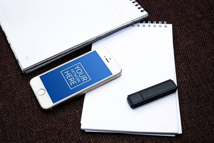 PSD spiral notepad with smartphone and flash drive mockup