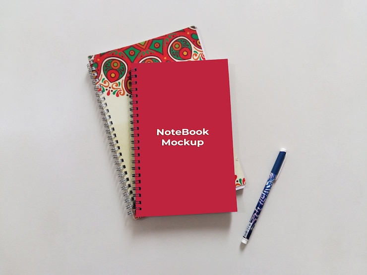PSD spiral portrait red notebook mockup with pen