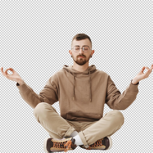 Spokojny, spokojny hipster siedzi na podłodze i medytuje. Uspokój się.